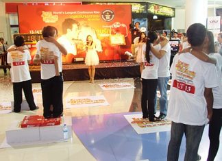 The kissing couple attempt to smooch their way into the record books at the Royal Garden Plaza in Pattaya, Feb. 14.